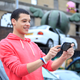 Illustration for article titled Attractive Young Men Smiling at the PlayStation Vita